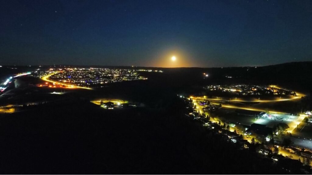 Cochrane at night under a full moon