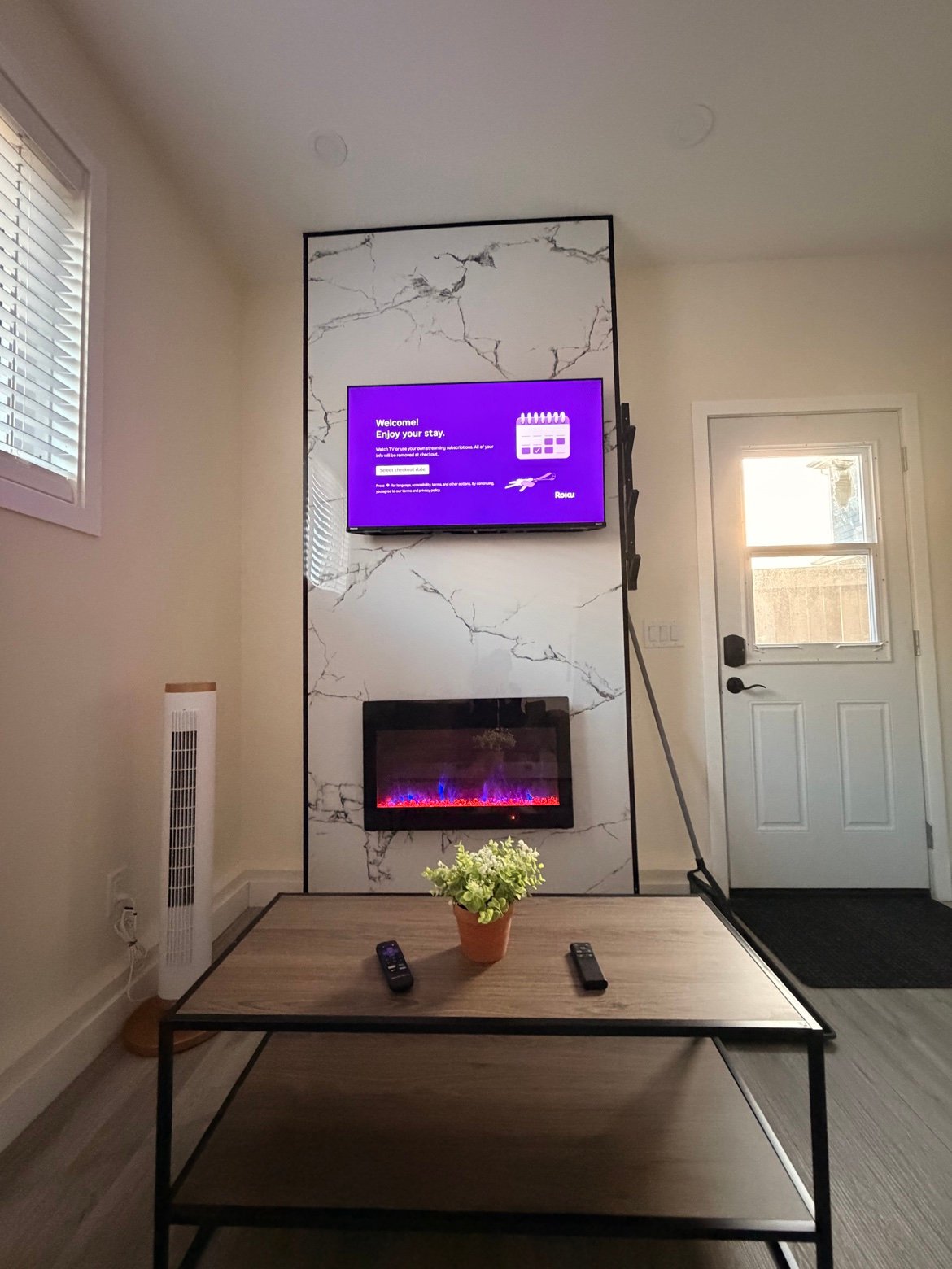 Roku TV and electric fireplace on